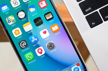 Load image into Gallery viewer, Free Black iPhone X on Glass Table with Macbook Pro PSD Mockup
